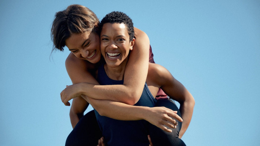 Women in GOODEN Sportswear hugging each other and having fun.